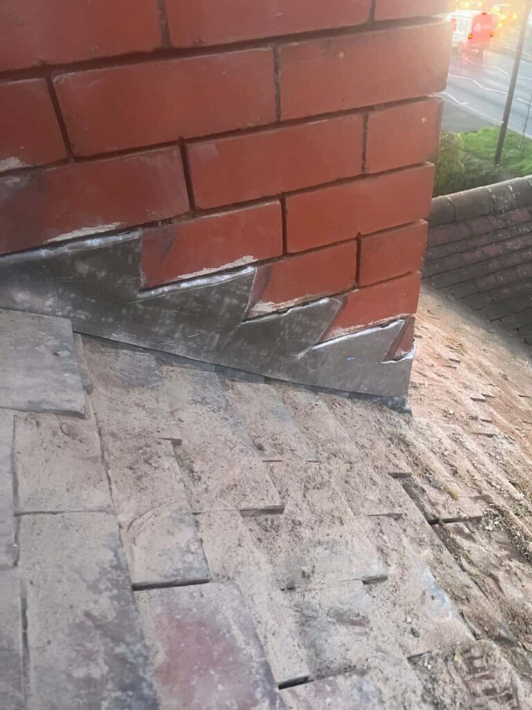 This is a photo of new leadwork being installed around an old chimney. Works carried out by MCM Roofing Repairs Tidworth